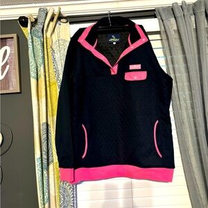 Black and hot pink quilted jacket.